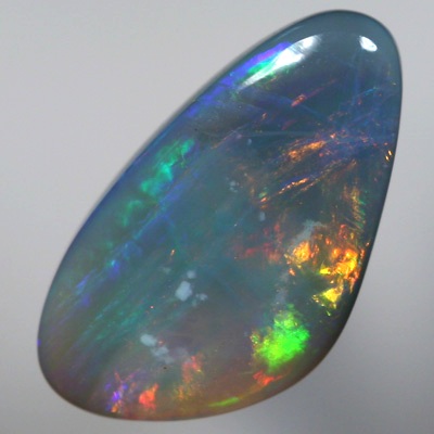 SOLID SEMI BLACK OPAL Large rolling flashes of reds, oranges over blue, purple